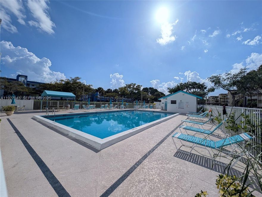 Nestled within the vibrant, over-55 community of Lucerne Lakes, this bright and spacious 2-bedroom, 2-bathroom plus den condo spans nearly 1400 square feet. Located within a secure elevator building.

The interior welcomes you with a fresh and contemporary feel, enhanced by smooth knockdown textured walls and ceilings throughout with new laminate flooring. The addition of a versatile den provides the perfect space for a home office, or convert to an additional bedroom. The entire home is equipped with impact windows, offering superior protection and noise reduction.

Practicality meets comfort with the inclusion of an interior laundry room, equipped with a full-size washer and dryer. Abundant closet space ensures all your belongings can be neatly organized. All furniture seen is included. 

Extend your living outdoors onto the inviting screened patio. Just steps away, residents of the Fairway Club enjoy exclusive access to a resort-style pool, perfect for cooling off on warm days.

Beyond your doorstep, the Lucerne Lakes community offers a vibrant social scene centered around its active clubhouse. Stay fit and socialize with access to pickleball courts alongside traditional tennis courts, and a well-equipped gym.

Excellent shopping centers and a diverse array of dining options are just a short drive away, ensuring you have everything you need within easy reach.

New Hot Water Heater installed 2025. Monthly dues include water, trash, internet and basic cable.