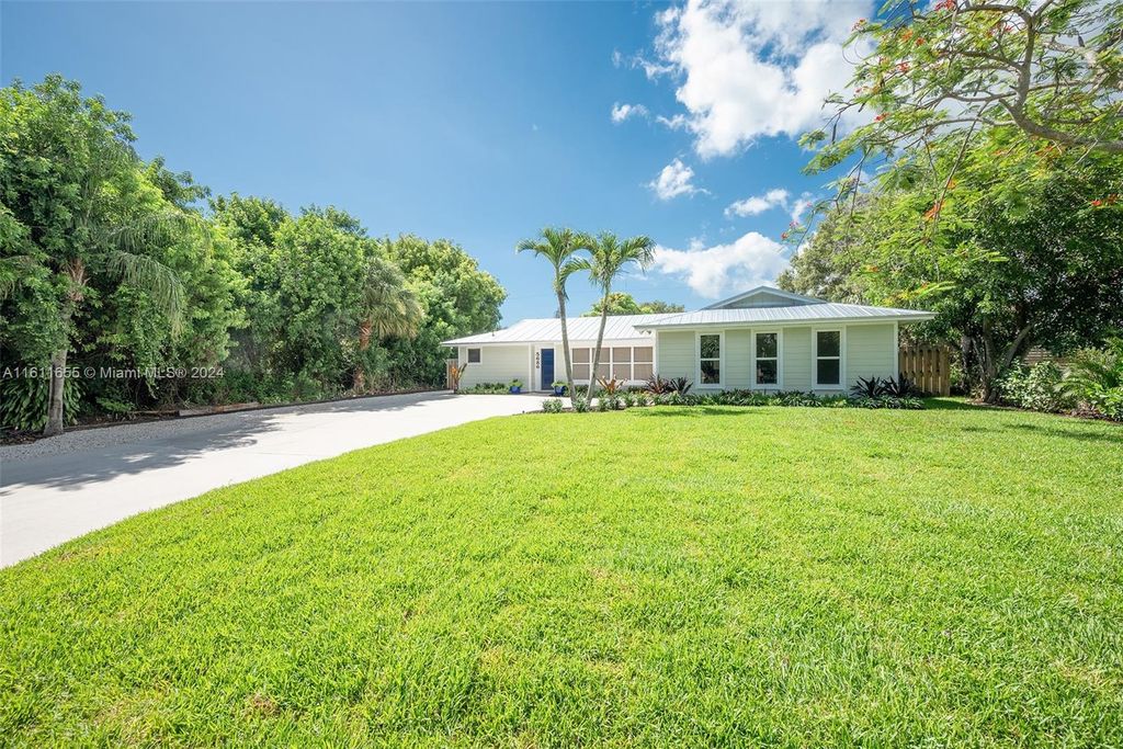 Photo of 5686 SE Matousek St, Stuart, FL 34997 (MLS # A11611655)