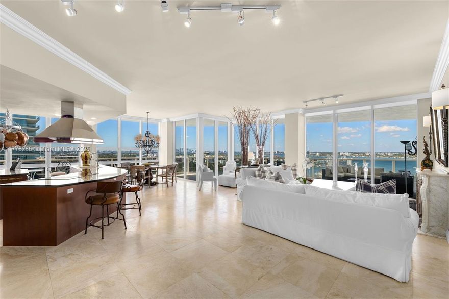 Experience sweeping views of the Intracoastal and Atlantic Ocean from this bright, flow-through residence at Bellini Bal Harbour. Perched on the sought-after southwest corner at an ideal height, clearing the building to the south — offering rare, uninterrupted views that are uniquely available from this line. Floor-to-ceiling windows and a spacious layout create a seamless indoor-outdoor flow. The open kitchen features a large island, custom cabinetry, and high-end appliances. A wraparound terrace, oversized bedrooms, and a generous primary suite with water views complete the home. Bellini offers an oceanfront pool, spa, fitness center, concierge, and valet—all in the heart of Bal Harbour near world-class shopping and dining.