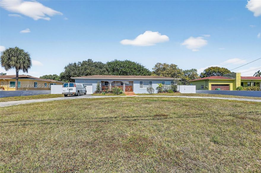 Beautifully updated single family pool home on the Biscayne River Canal with ocean access—perfect for kayaking and paddleboarding. This 2,475 SF residence sits on an oversized 26,000 SF lot, featuring a large front yard with circular driveway and a one car garage for ample parking, and a fenced backyard with mature landscaping and room for future home expansion or enhancements such as a tennis court, covered patio, gazebo, or summer kitchen. The welcoming front porch leads into an open floor plan filled with natural light from impact windows, a main suite with hardwood flooring and a spacious custom walk in closet, two additional split bedrooms, two remodeled bathrooms, a cozy kitchen, and versatile living areas with elegant porcelain flooring throughout, designed to adapt to your lifestyle over time, offering multiple layout possibilities, and positioned to overlook the serene outdoor area with pool and jacuzzi, perfect for relaxing or entertaining. Conveniently located near I-95, Turnpike and the Palmetto Expressway, hospitals, and just minutes from Aventura and Sunny Isles, this home combines generous indoor comfort with exceptional outdoor potential, making it a rare blend of waterfront living, space, privacy, style and natural beauty