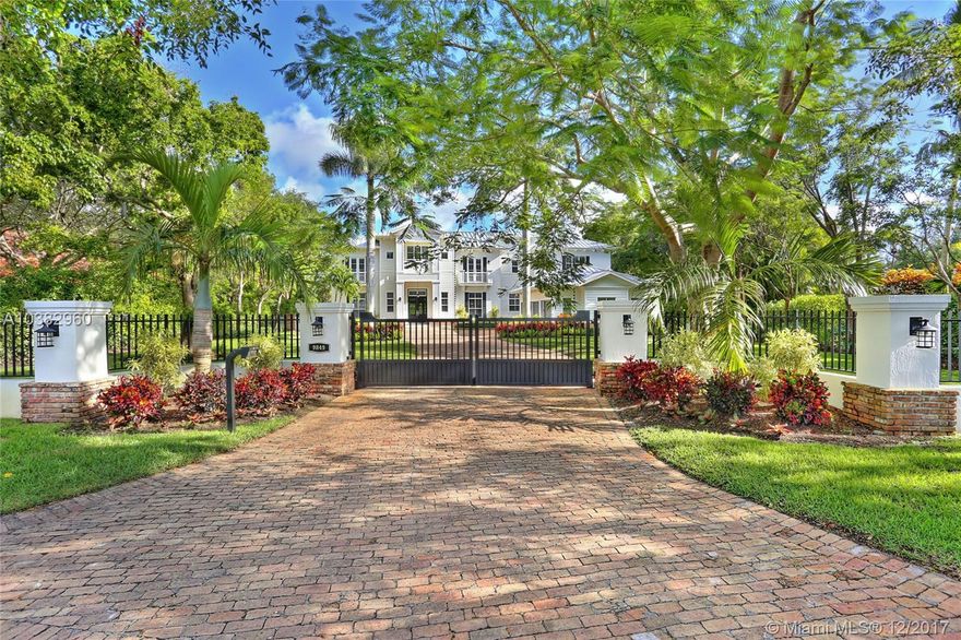 Come and be dazzled! If you are passionate about details, location and lifestyle, your search ends here! Showcase custom retreat on one of the best streets in N. Pinecrest. Gated estate with top end finishes and large entertaining spaces. Gourmet kitchen with family room and bar, den, office and 2 floors of dramatic wide terraces the full width of the house. Elevator, wine cellar and generator. Resort style heated pool and patio, summer kitchen and huge backyard with gazebo. Pinecrest/Palmetto schools.