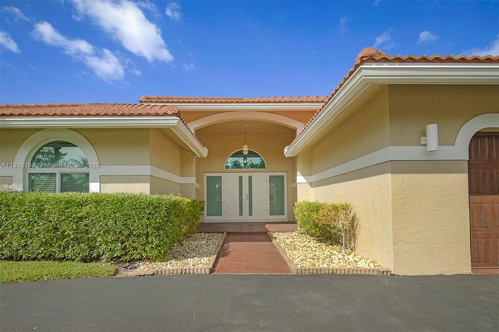 Photo of 10133 NW 48th Dr, Coral Springs, FL 33076 (MLS # A11916198)