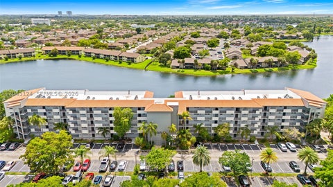 Photo of 4025 N Nob Hill Rd #301, Sunrise, FL 33351 (MLS # A12043124)