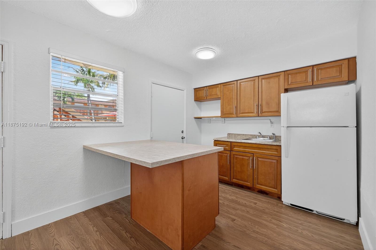 RAPID APPROVAL!!! 2 bedroom, 1 bathroom located in the heart of Hialeah. This ample apartment features tile flooring, freshly painted walls, open kitchen, wall ac unit, window treatment, spacious room, walk-in closet & 1 parking spot. Minutes away from shopping plazas and major highways. Washer/dryer room available in common area. Water is included. $25 monthly pet fee for small breed only.