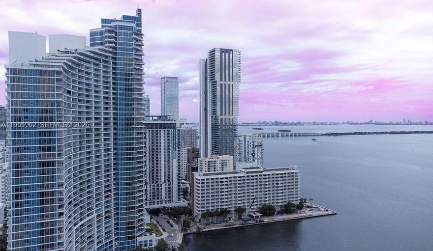 Experience breathtaking living in this 2-bed, 2.5-bath condo at Quantum on the Bay! This modern unit offers a wraparound balcony with water views and downtown sunsets. The primary bedroom features its own balcony overlooking the water. Located in a vibrant area with Margaret Pace Park right in front, you’re just minutes from Miami Beach and the Design District. The open layout feels like home, with a modern kitchen, in-unit laundry, and spacious closets. Built in 2008, the full-service building offers a gym, pool, theater room, and more. Walk to shops, dining, and the Kaseya Center—Miami living at its finest!