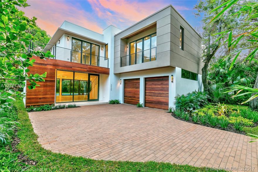 This STUNNING MODERN-CONTEMPORARY new construction in THE GROVE, with 5 BR, 4 BA and 2 1/2 BA sits on a 10,000 sqft lot. 2nd-floor studio, sundeck, 2 car garage, covered terrace, balcony, and pool are among its features.  Surrounded by lush foliage with cutting edge design by renowned CAD Studio. Unbeatable location. Quiet street, border with Gables, surrounded by the best schools in the City, min. from SoMi, with parks, restaurants, entertainment just min. away. Ready to move in!
