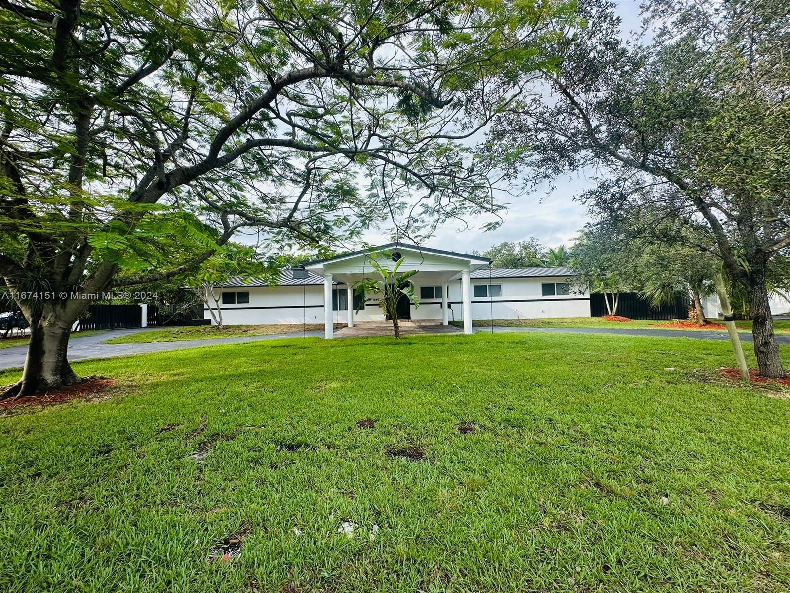 Luxury 5-Bed, 4-Bath Corner Home in Palmetto Bay. Beautifully designed, this spacious 5-bedroom, 4-bath corner home features custom solid wood vanities, LED-lit mirrors, and a modern kitchen with quartz countertops. Enjoy two living areas, dining spaces, and remote-controlled ceiling fans in each bedroom. The large private patio, shed, garage, and expansive driveway (fits 8+ cars) offer ample space. Dual central AC systems ensure year-round comfort. A perfect blend of luxury and convenience for your family to call home.