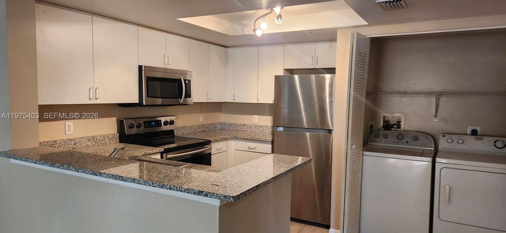 Photo of 4151 N Haverhill Rd #1520, West Palm Beach, FL 33417 (MLS # A11975403)