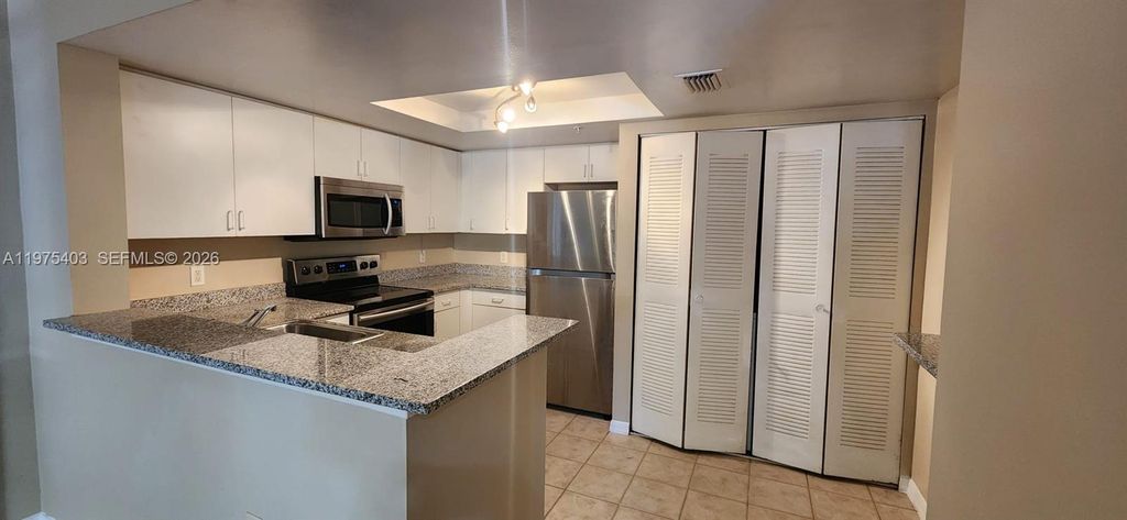 Photo of 4151 N Haverhill Rd #1520, West Palm Beach, FL 33417 (MLS # A11975403)