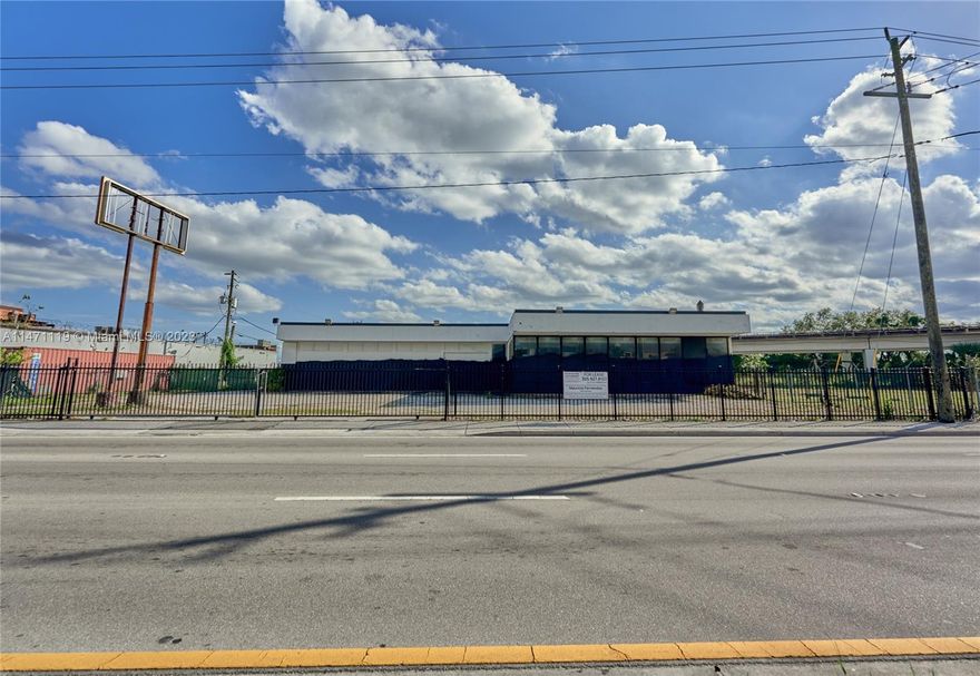 Explore a prime commercial rental in an Opportunity Zone, offering tax benefits to your business. This 1.028-acre property features 44,779 sq ft, including an 8,000 sq ft main structure with 300 sq ft office space, two bathrooms, and 18ft ceilings with 4 drive-thru bays. Positioned on NW 79th Street with a 322 ft frontage, it ensures visibility with 35,000+ daily traffic. Strategically located, it's four blocks from a Walmart Supercenter and the metro station, attracting diverse customers. In a thriving commercial district, neighbors include Harbor Freight, Walgreens, McDonald's, Burger King, and Family Dollar. This property offers a unique opportunity to establish your business in a prime commercial hub. Don't miss this opportunity!!