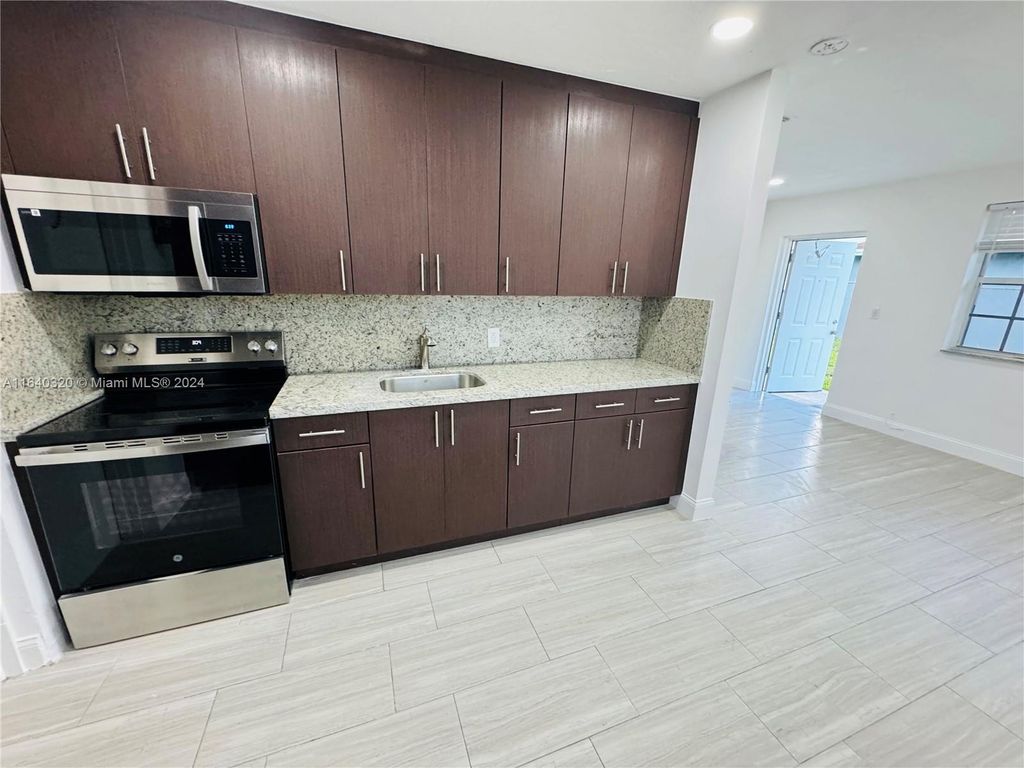 Photo of 631 NW 11th Ave #A, Fort Lauderdale, FL 33311 (MLS # A11640320)