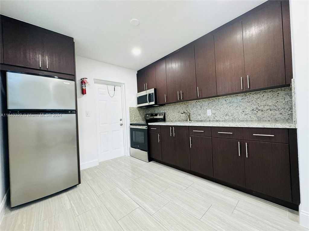 Photo of 631 NW 11th Ave #A, Fort Lauderdale, FL 33311 (MLS # A11640320)