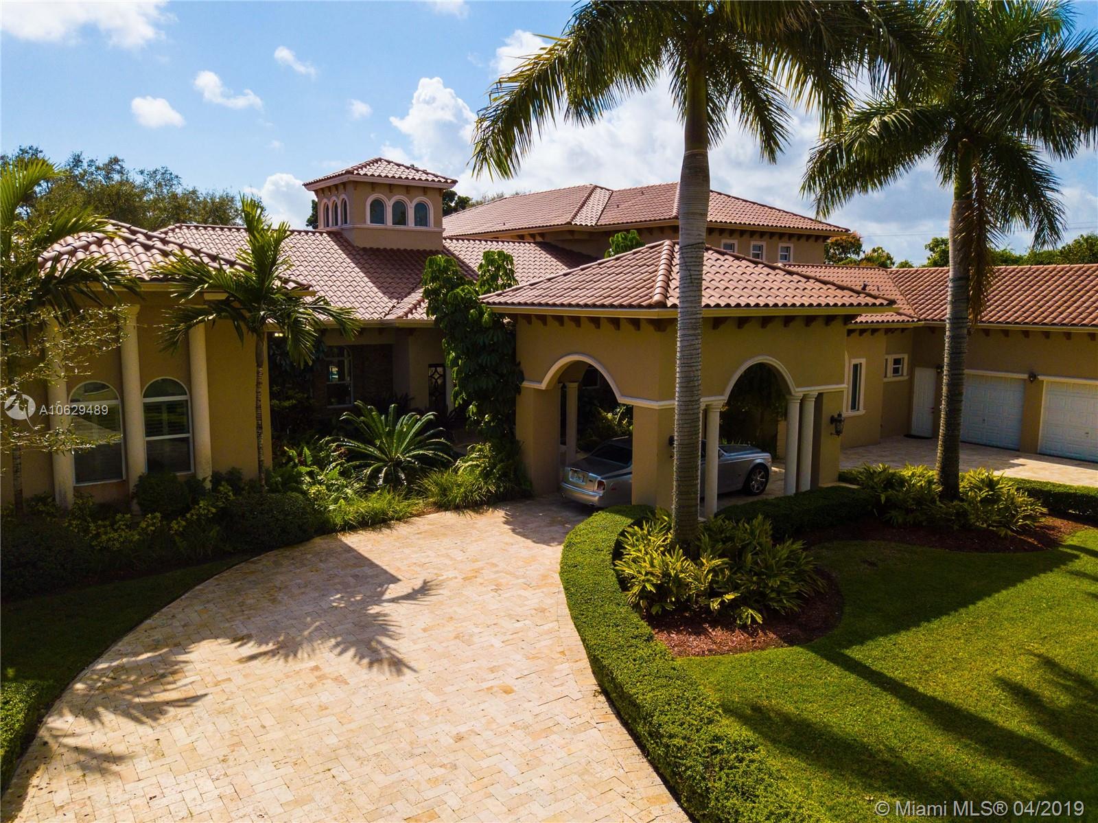 Beautiful Estate designed with great taste and incredible attention to detail, 9,912 Sq.Ft. on a 46,609 Sq.Ft. lot. Italian Marble throughout the home, astonishing Kitchen with unique granite counter tops and costume cabinets, a home- chef's dream. Presidential Master Suite with a five star bathroom and walk-in vestier, 6 bed room suites each with walk-in closet and diferente bathroom design. Billar Room, Media Closet. Family Room with bay windows overlooking spectacular Pool with its own fountain and built-in jacuzzi,spacious garden and patio area. On the second floor a beautiful terrace,home theater with 16 electrical recliners with leather seats and state of the art sound.Exotic Koi pond. Elevator ,3 car Garage and driveway that accommodates up to 18 cars, Your dream home, a must see!!