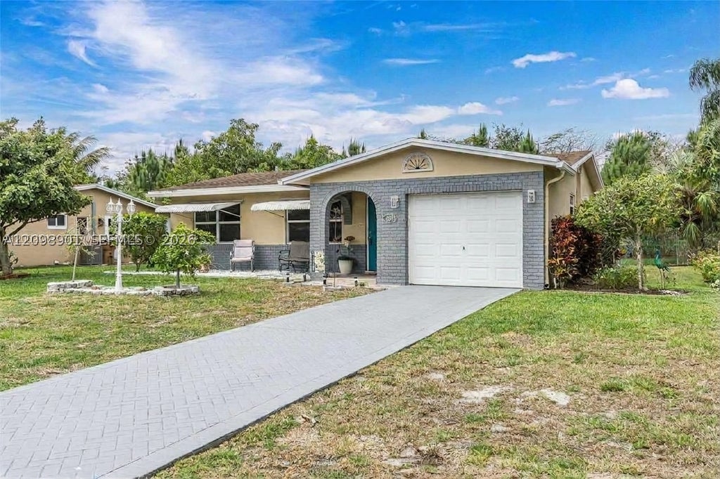 Photo of 4871 NW 13th Ave, Deerfield Beach, FL 33064 (MLS # A12098901)