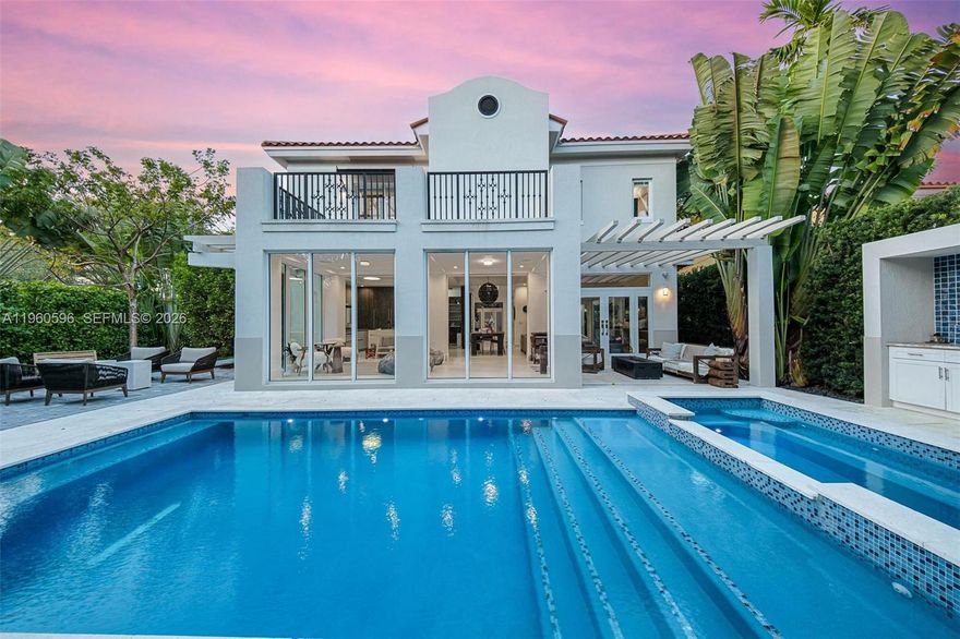 Welcome to 722 Navarre Ave. Striking 2021-built modern residence located on a quiet, tree-lined street in prime Coral Gables, just minutes from Miracle Mile. This thoughtfully designed 4 BD / 4 BA home features soaring ceilings, abundant natural light, and a seamless open-concept layout ideal for both living and entertaining. The chef’s kitchen is outfitted with Sub-Zero & Wolf appliances, custom cabinetry, a walk-in pantry. Floor-to-ceiling glass doors open to a private backyard oasis with a resort-style pool and spa, covered terrace, and summer kitchen, creating effortless indoor-outdoor living. Conveniently located near world-class dining, luxury shopping, parks, golf, and top-rated schools, offering the perfect balance of modern luxury, privacy, and walkability in the heart of Coral Gables.