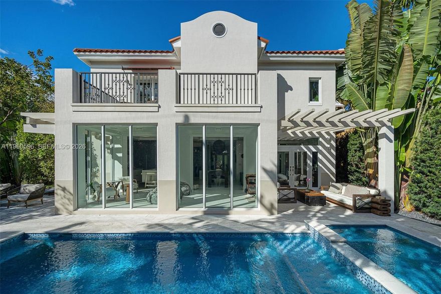 Welcome to 722 Navarre Ave. Striking 2021-built modern residence located on a quiet, tree-lined street in prime Coral Gables, just minutes from Miracle Mile. This thoughtfully designed 4 BD / 4 BA home features soaring ceilings, abundant natural light, and a seamless open-concept layout ideal for both living and entertaining. The chef’s kitchen is outfitted with Sub-Zero & Wolf appliances, custom cabinetry, a walk-in pantry. Floor-to-ceiling glass doors open to a private backyard oasis with a resort-style pool and spa, covered terrace, and summer kitchen, creating effortless indoor-outdoor living. Conveniently located near world-class dining, luxury shopping, parks, golf, and top-rated schools, offering the perfect balance of modern luxury, privacy, and walkability in the heart of Coral Gables.