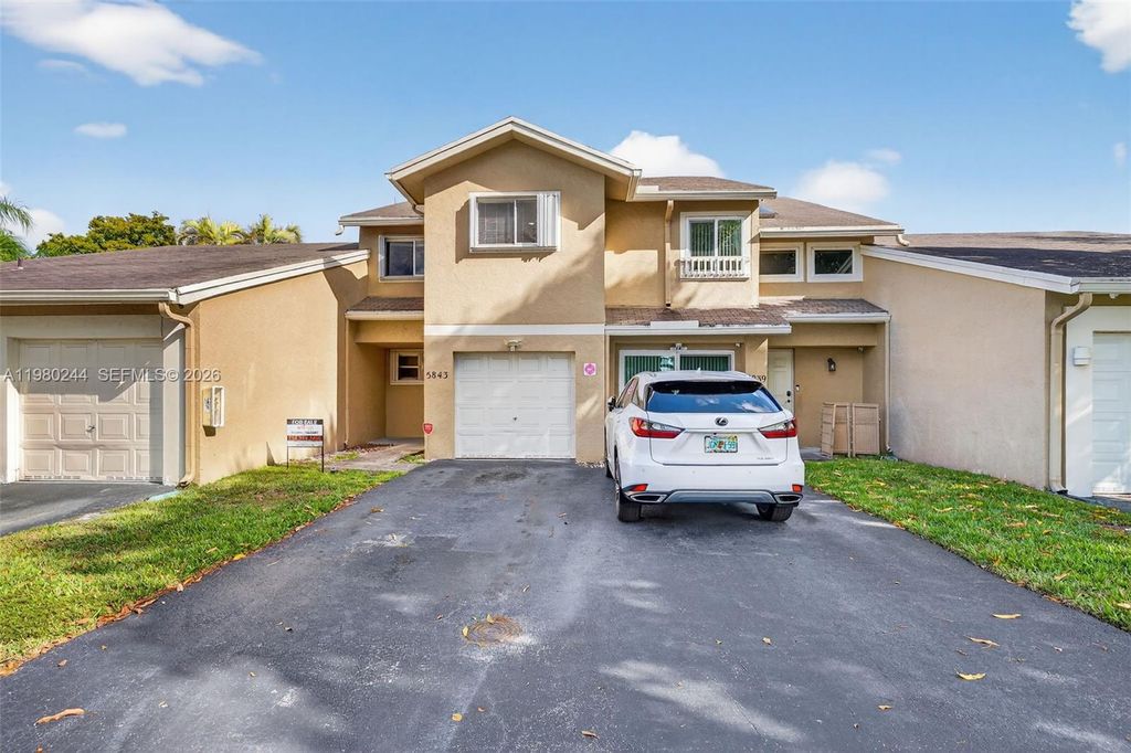 Photo of 5843 Woodlands Blvd, Tamarac, FL 33319 (MLS # A11980244)