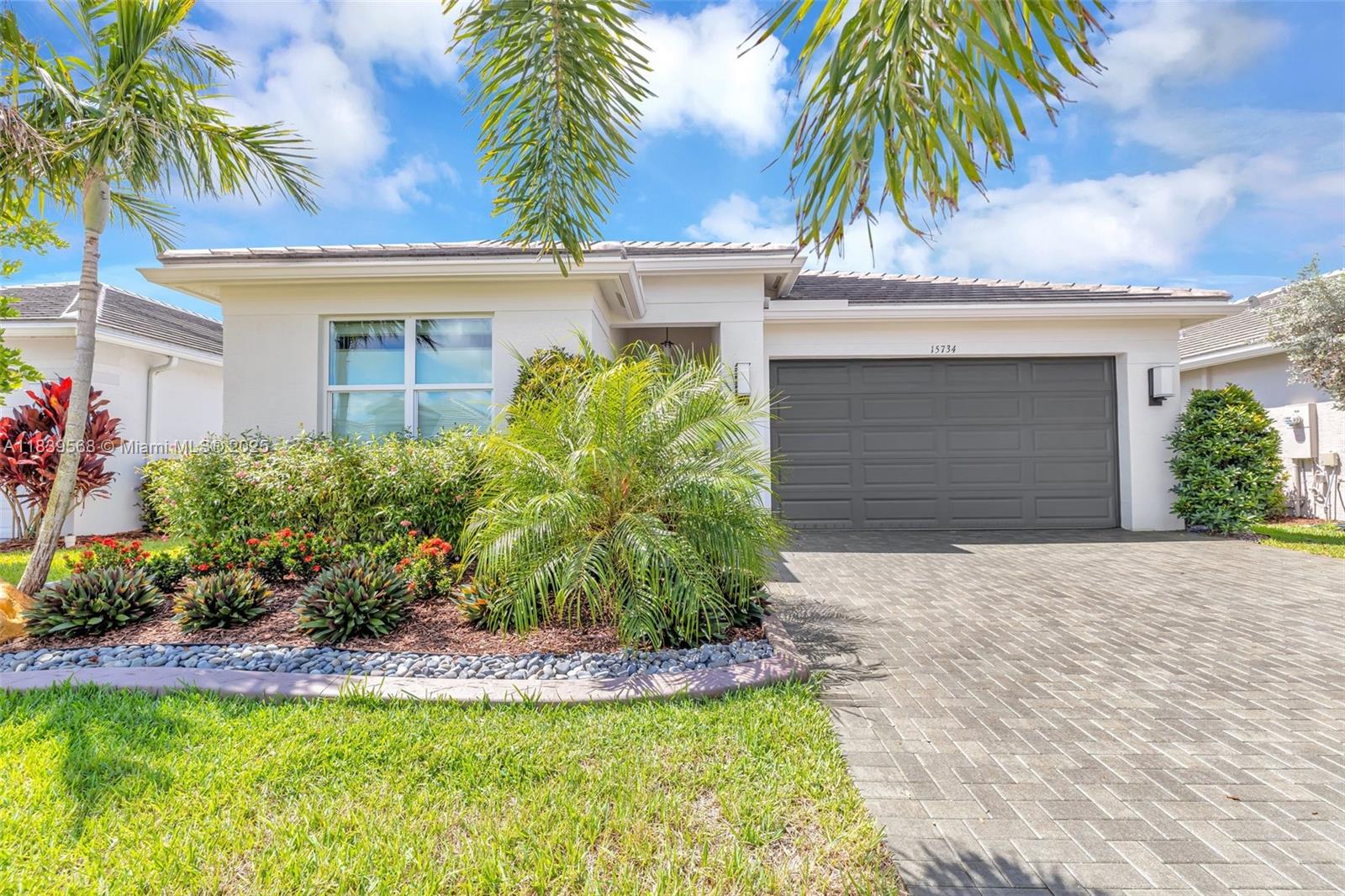Upgrades galore in this stunning, spectacular decorated Sandpiper model! Enjoy luxury vinyl flooring throughout, elegant built-ins, and eye-catching decorative molding. The kitchen features a custom backsplash and high-end finishes. Every room is thoughtfully styled with upscale lighting and designer touches that elevate the entire space. Step outside to your extended lanai and take in peaceful lake views—perfect for entertaining or relaxing. Nothing has been overlooked in this meticulously maintained home. Move right in and enjoy the elevated lifestyle you deserve!