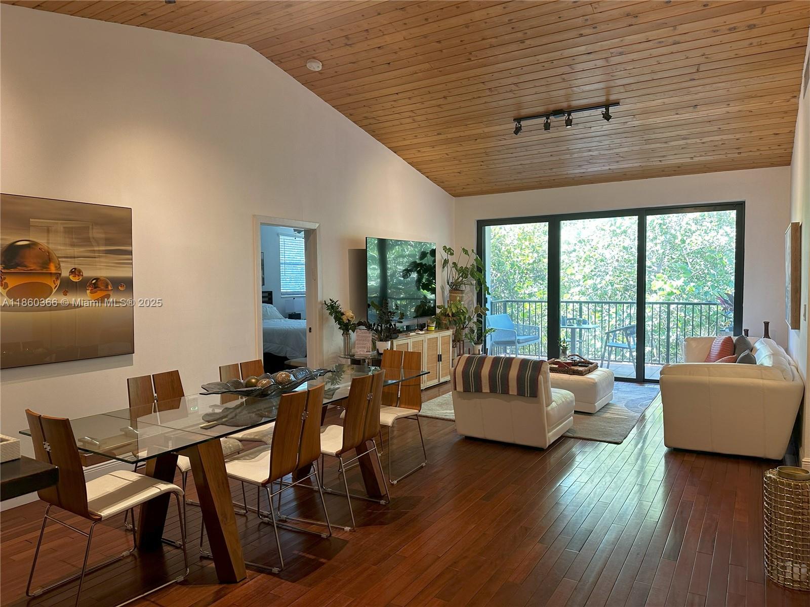 Vaulted ceilings in this spacious, top floor, corner residence at Ocean Village Condo in Key Biscayne. Split floor plan, wood floors throughout, new impact windows. Master bedroom with His & Hers walk-in closets. Master bathroom with double sinks and marble walls and countertop. Upgraded kitchen with SS appliances, granite countertops and full size washer& dryer. This gated community with 24 hrs. guard has undergone extensive renovations including new flooring throughout the common areas and new railings in balconies. Features two swimming pools, jacuzzi, recreation room, barbecue area and lush vegetation.Walking distance to the beach and all that the wonderful City of Key Biscayne has to offer.