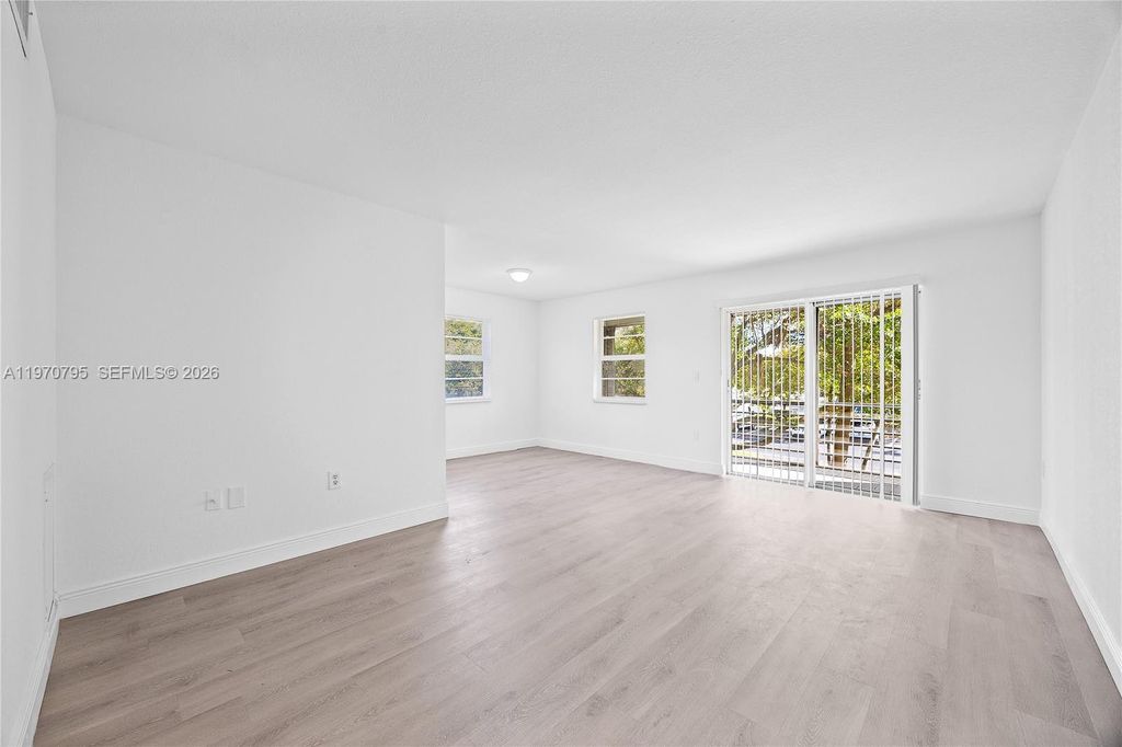 Photo of 4990 E Sabal Palm Blvd #202, Tamarac, FL 33319 (MLS # A11970795)