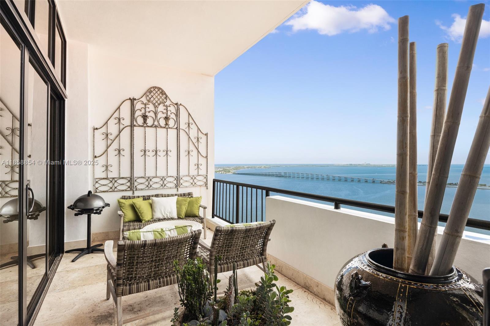 Discover an unparalleled lifestyle in this rarely available lower penthouse at iconic Villa Regina. Experience breathtaking bay views from this fully renovated residence featuring 12-ft ceilings, marble floors, impact glass & custom millwork. Gourmet kitchen w/ premium cabinetry, wine cooler & built-in breakfast nook. Luxurious primary suite offers a spa-like bath, walk-in closet & private terrace w/ stunning views. Spacious second bedroom & versatile walk-through den/library add functionality. Full-size laundry/utility rm. 2 garage spaces. Villa Regina offers top-tier amenities: waterfront pool, marina, gym, spa & more. Located on the quiet side of Brickell, steps from top dining & financial district. Enjoy a unique lifestyle that offers a vibrant city life in a serene, perched retreat.
