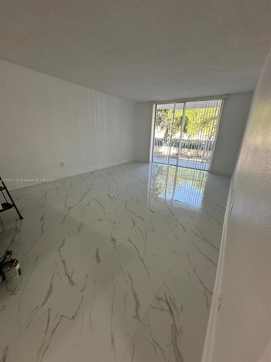 Step into this spacious 2-bedroom, 2-bathroom unit featuring a open concept kitchen with new stainless steel appliances. Enjoy the elegance of new tile floors throughout the unit, ensuring a modern and easy-to-maintain living space. With rapid approval, you can seize the chance to make this your new home!