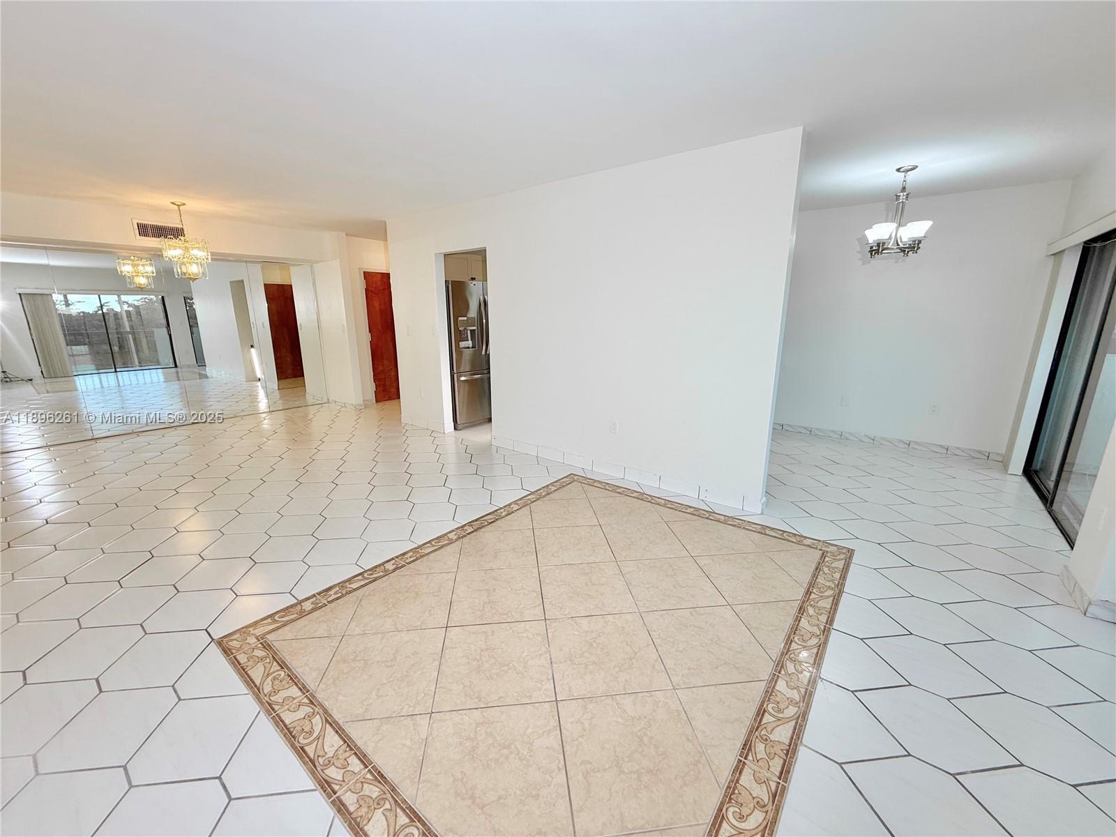 Welcome to this beautifully remodeled 2BD/2BA condo featuring breathtaking sunrise views from your open balcony! Spacious split floor plan ensures total privacy. The open-concept living & dining area is enhanced with custom mirrors, providing a bright & airy feel. Enjoy a modern kitchen with granite countertops, pantry, and cozy breakfast nook—perfect for morning coffee. Plus the convenience of an in-unit washer & dryer, spacious walk-in closets, plus extra storage, & upgraded bathrooms that enhance your comfort. New A/C for efficiency. Gated community with 24-hr guard, clubhouse, 2 pools overlooking canal, basketball & racquetball courts, ideal for an active lifestyle. Prime Kendall location near top rated schools, shopping centers & highways. Building recertifications near completion!