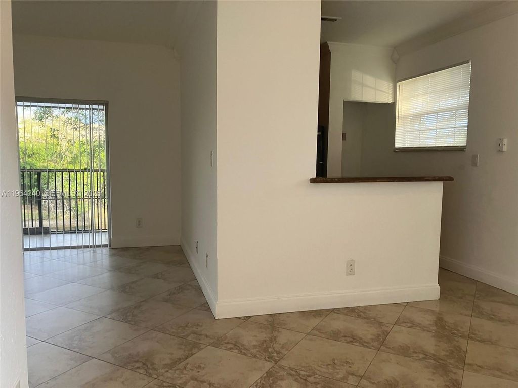 Photo of 620 Cypress Club Way #L13, Deerfield Beach, FL 33064 (MLS # A11964240)