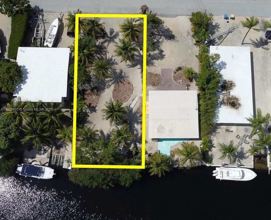 WATERFRONT DEEP WATER LOT!! Owner financing possible! Fantastic RARE Opportunity to build with 50' OF WATERFRONT 6250 SQ FT Plantation Key Islamorada LOT...building rights available to apply to this great lot!! T-Dock possibility on the trimmed mangrove lot. DEEP WATER at shoreline. House and lot next door are sold separately...purchase both together and use as your getaway while you build on the other lot, or build two 2 homes, or a family estate! Fabulous popular neighborhood with easy Ocean and Bay access A voluntary HOA provides access to the private bay front homeowner's park, beach, truck/trailer parking, and boat ramp! Build your dream home Right Here Right Now! Ask about buying next door house on lot with building right separately, or to combine with this lot ...  Priced to sell!
