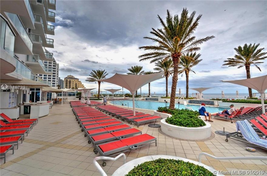 Fort Lauderdale Beach! This is a TRUE 1 Bedroom / 1.5 Bath Fully Furnished, Turnkey Condo-Hotel in the Hilton Fort Lauderdale Beach Resort. Full Kitchen.  The Bedroom is separate from the Living/Kitchen area. Floor to Ceiling Impact Windows/Doors, Balcony Access from both the Bedroom and the Living Room. Owners have locked closets in the unit with Washer/Dryer and for personal belongings. Resort Amenities Include Tropical Pool Deck Overlooking the Atlantic Ocean, Spa, Fitness Center, 4 Restaurants, 3 Bars, Room Service, Concierge and much more! Optional Rental Program is available. This 1BR, 1 1/2 Bath unit has 906 sq. ft.