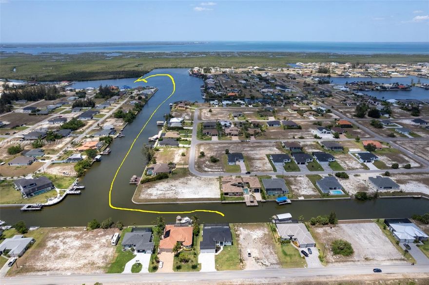 DIRECT GULF ACCESS contemporary 4-bed, 3-bath waterfront home on Taurus Canal w/ NO BRIDGES! Includes pool, Jacuzzi spa, and spacious 3-car garage. Boater’s dream with 125’ seawall—room for Captain’s Walk, boat lift, kayak launch & tiki hut. Located near future Seven Islands Waterfront Community w/ marinas, dining & parks. Bright, open layout w/ 14' ceilings, impact windows/doors, tile flooring & west rear exposure for stunning sunsets. Modern kitchen w/ quartz waterfall island, Italian cabinets & SS appliances. Luxurious primary suite w/ lanai access, spa bath, walk-in closets. Split floorplan for privacy, outdoor screened lanai for entertaining. Adjacent lot for sale, expand or customize! Smart investment! $2,300/year flood (LOMA can be obtained!) & $2,000/y homeowner insurances.