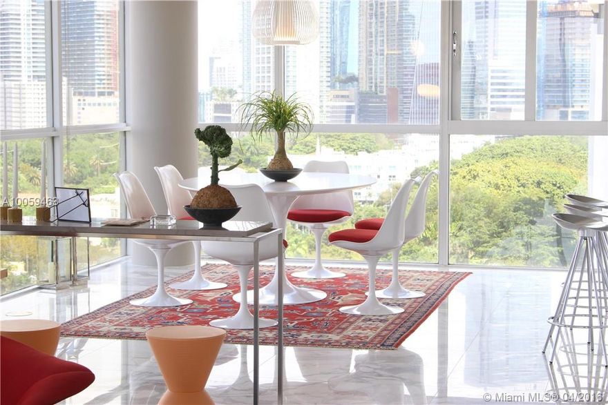 ENJOY MORNING COFFEE OR THE EVENING SUNSET ON THE OVERSIZED BALCONY LOOKING EAST TO THE BAY AND WEST.  ENTER THE GRACIOUS LIVING/DINING/KITCHEN AREA WITH EXQUISITE WHITE MARBLE FLOORS WITH FLOOR TO CEILING GLASS VIEWS TO THE SOUTH, WEST,  AND NORTH.  DAY AND NIGHT, THE VIEW IS SPECTACULAR INCLUDING THE SKYLINE OF DOWNTOWN MIAMI.  IS IT ANY WONDER THAT THIS CORNER UNIT IS THE MOST DESIRABLE IN THE ICONIC ATLANTIS.  2/2 WITH HALF BATH.  ALL RENOVATED. BEDROOMS FEATURE SLIDING GLASS DOORS TO BALCONY.