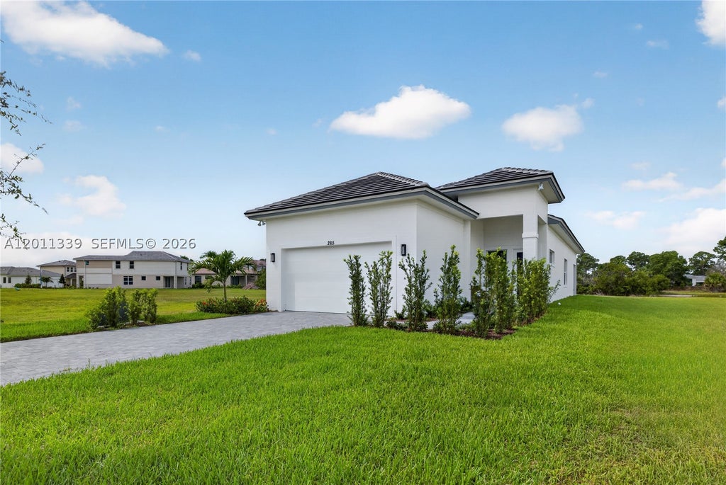 Photo of 265 SE Via Sangro, Port St Lucie, FL 34952 (MLS # A12011339)