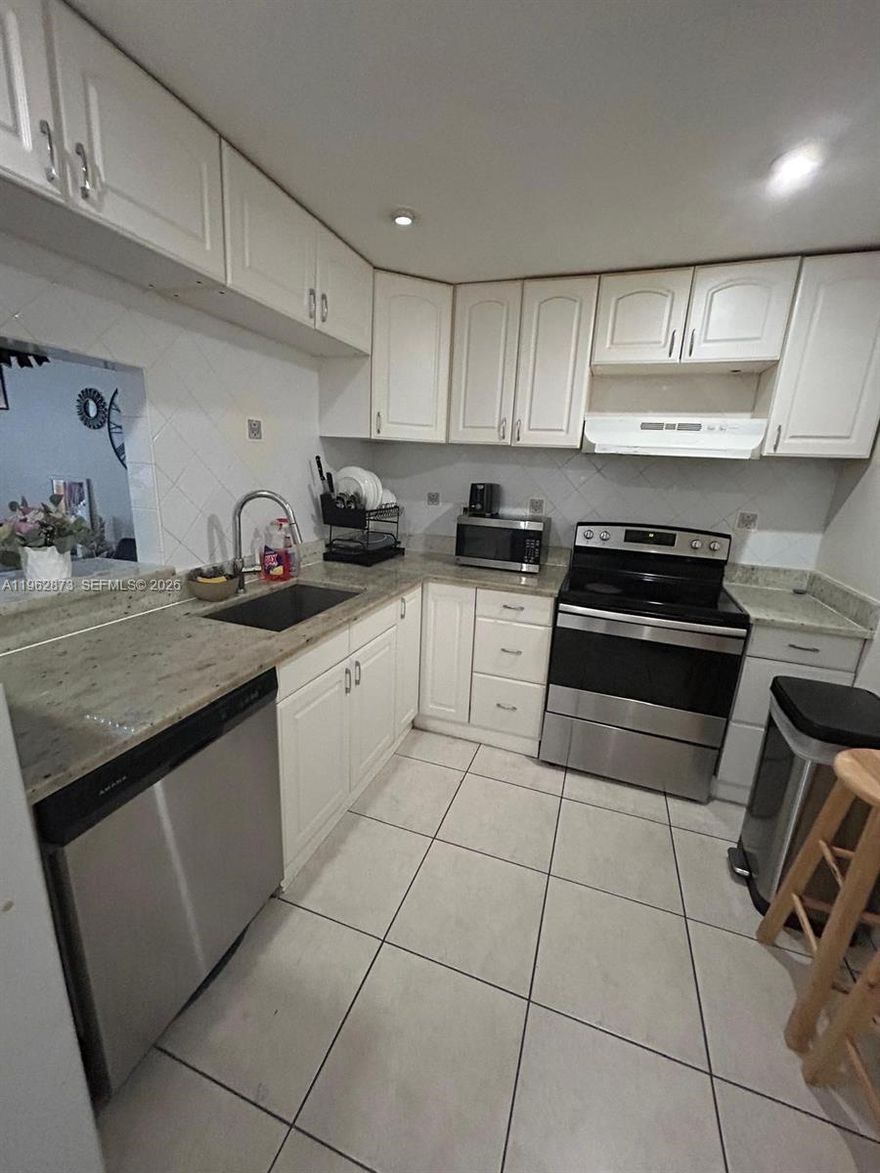 CALLING ALL INVESTORS!! UNIT RENTED! 2 beds, 2 full baths, remodeled bathroom, quartz countertop in kitchen, stainless steel appliances, tiles, impact windows, close to major highways! Investor friendly community!