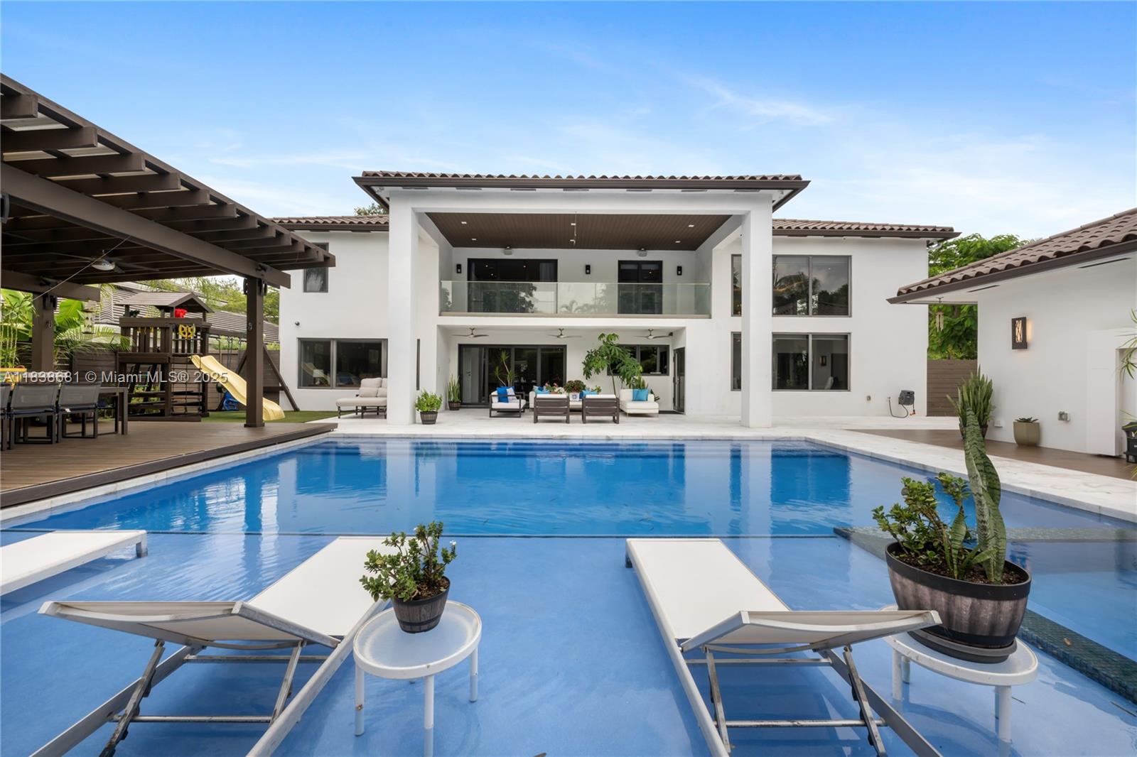 Unique opportunity to live in this stunning 6BR/7.5BA home in exclusive Doral Estates. Custom-designed built with top-quality finishes, including Italian kitchen, Italian marble floors, real wood floors, Italian custom made closets, European pending lamps and drapes, smart shades and lighting and sound system everywhere. Includes a flexible office/bedroom built with concrete plaque, a separated in-law suite, huge playroom, elegant built-in furniture, and underground full-house power generator. Enjoy outdoor living with a large gazebo, built-in BBQ kitchen, and oversized 32x25 Ft heated saltwater pool + jacuzzi. Is a Luxury living experience in Doral’s most prestigious gated community. *Rent includes: Pool and Landscaping maintenance, Pest control, and power generator maintenance.