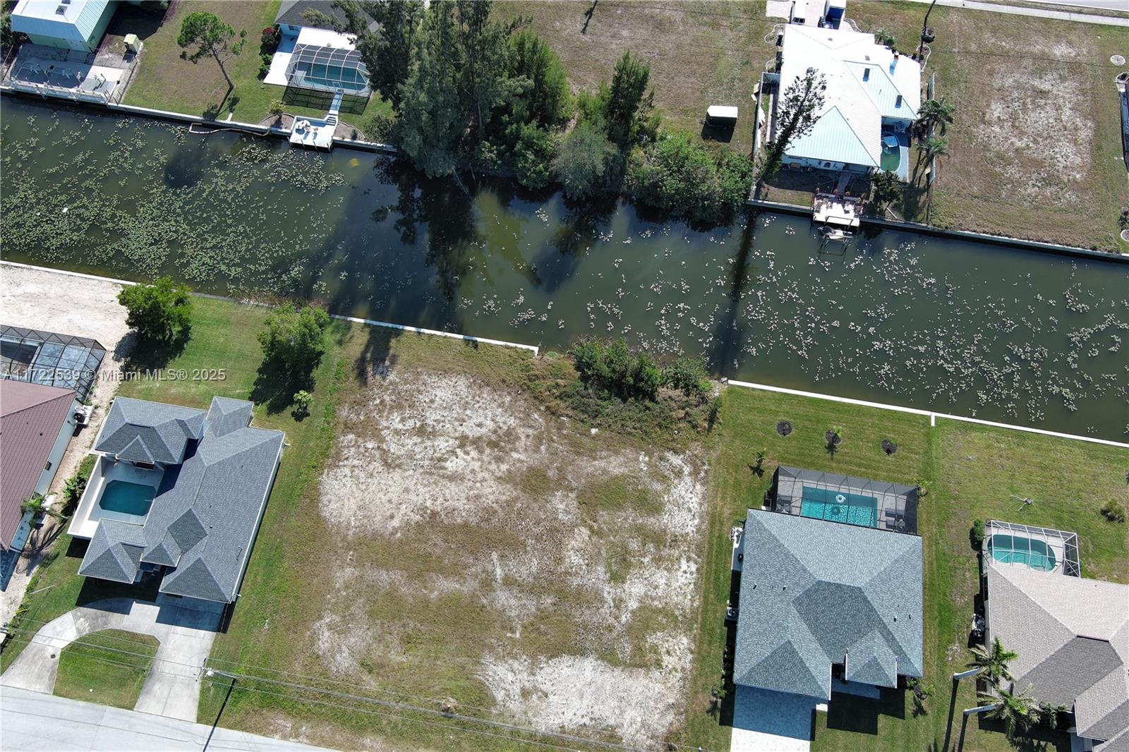 SELLER FINANCING AVAILABLE! This vacant land offers a prime opportunity for you to build your dream home in SW Cape Coral. With a clean lot and fresh water assessment paid, you can start construction without any hassle or extra costs. The property features a brand new seawall, providing added protection and value to your investment. Imagine waking up to stunning waterfront views from your own backyard, fishing, and other water activities. Convenience is key, as the land is also conveniently located near a shopping center, offering easy access to amenities. Don't miss out on the chance to own this waterfront property with a new seawall, where you can create the perfect coastal lifestyle.