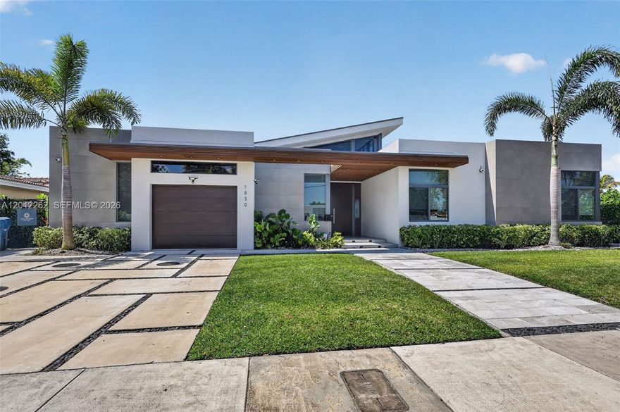 This is the lakefront opportunity buyers wait for! An exceptional residence built in 2022 in one of the area’s most sought-after neighborhoods, set on a rare swimmable lake with private, unobstructed water views. Designed for impact, the home features 6 Bedrooms, 5 full bathrooms, and 2 half bathrooms, soaring ceilings, walls of glass, and seamless indoor-outdoor flow that creates the ultimate setting for entertaining and everyday living. The Mia Cucina kitchen is equipped with top-of-the-line Sub-Zero & Wolf appliances, along with both indoor and outdoor kitchen setups and gas throughout the home. Step outside to a backyard that delivers a true resort experience with a gas-heated saltwater pool and impressive space to relax or host on the water. Additional highlights include a nanny suite, dual HVAC systems, and premium finishes including a built-in wine fridge. No HOA. No restrictions. conveniently located minutes from Aventura Mall, shopping, dining, the beach, and more cultural destinations. Waterfront homes with this combination of privacy, design, and location rarely come available! don’t miss it!