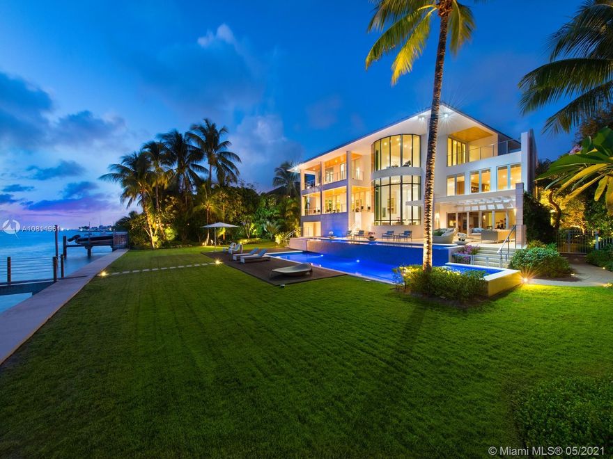 Enjoy ocean and sunset views from this 2014 Mashta Island estate on a 23,814 SqFt oversized lot with 138ft of water frontage. This custom-built home, inspired by Modern architect Richard Meier, features pure geometric lines and integrated open spaces with an emphasis on natural light. Unique features include a 3-story curved glass curtain wall, 14 skylights over a 27-ft high atrium, NanaWall folding glass doors, elevator, gym, dock, staff quarters, 4-car garage, generator and smart home technology.