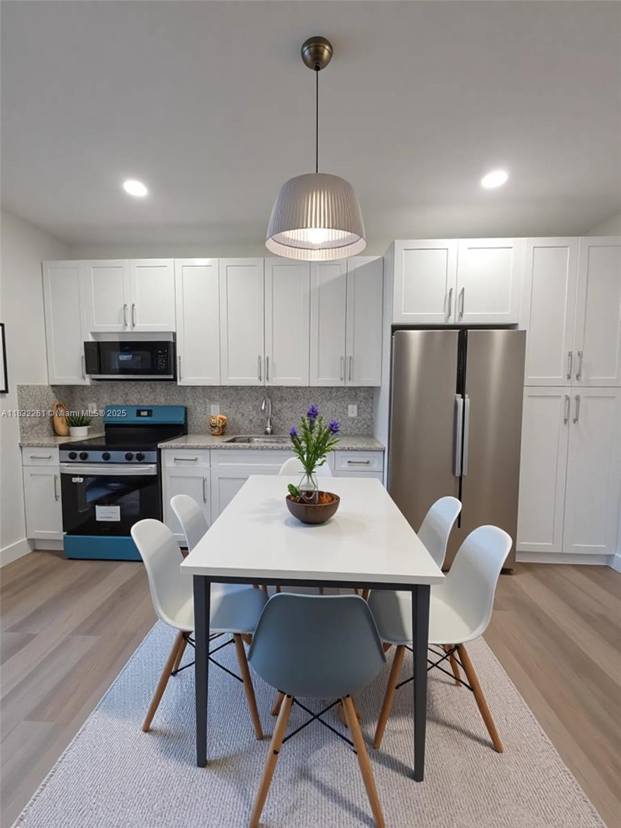 Section 8 Voucher accepted. Be the first to enjoy this new, clean, and bright 4-bedroom, 2-bathroom duplex! Everything is fresh and ready for you. Cook with ease in your beautiful kitchen, equipped with all-new appliances, and say goodbye to laundromats with an included washer and dryer. All-wood flooring connecting the kitchen, dining area, and spacious family room. For added storm security and peace of mind, this home features impact windows and doors. The master suite has its own bathroom, a large walk-in shower, and ample closet space. Plus, a shaded outdoor Patio and convenient parking is right at your doorstep.
Equipped with a new AC unit and all-new appliances, this home is designed for comfort and efficiency. And with parking just steps from your door, convenience is key!