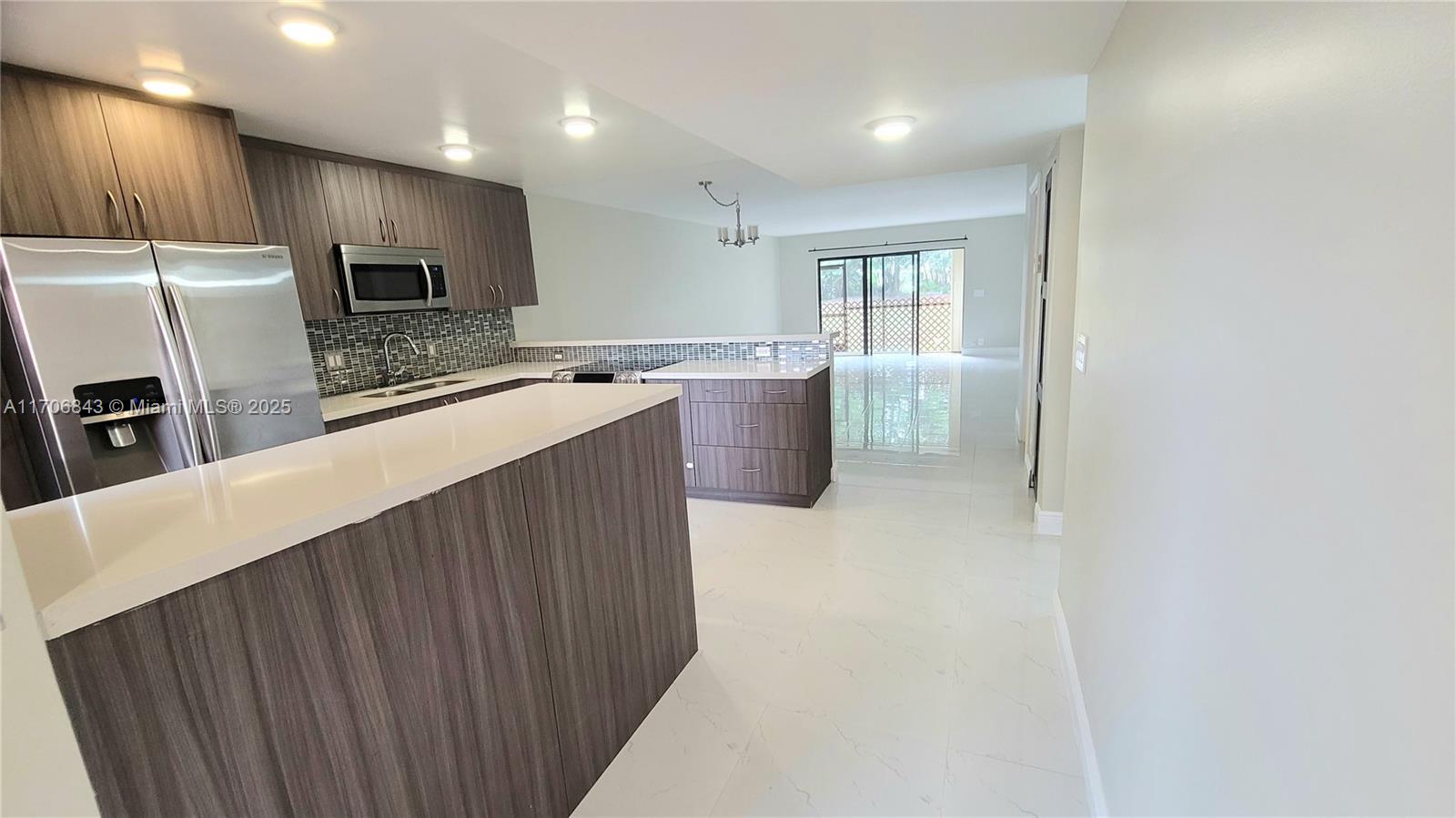 Unique 3-Bedroom, 2.5-Bath Condo
This is the only 3-bedroom, 2.5-bath unit in the entire community, offering a rare and exclusive opportunity. The condo features a modern open-concept kitchen, spacious closets, included storages, and beautifully updated bathrooms and kitchen.
Enjoy serene canal views and the added protection of accordion hurricane shutters. Located in Weston, a highly desirable area known for its top-rated schools and exceptional quality of life. No rental restrictions. Ready to show.