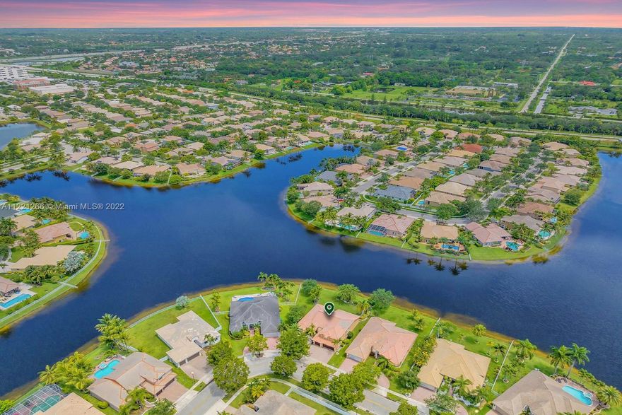 BEAUTIFUL 4 BED + LOFT + OFFICE, 3.5 BATH LAKEFRONT HOME ON PREMIUM OVERSIZED WATERFRONT LOT IN SOUGHT AFTER PEMBROKE FALLS. MANICURED LANDSCAPING, 3 CAR GARAGE, ELEGANT DOUBLE DOOR ENTRY WELCOMES INTO THE SPACIOUS 3,345 SF HOME. BRILLIANT OPEN PLAN W HIGH CEILINGS & LARGE WINDOWS. 1ST FLOOR PRIMARY SUITE HAS ACCESS TO BACKYARD, WALK-IN CLOSETS & ENSUITE BATH W DOUBLE VANITY, SOAKING TUB & SEPARATE SHOWER. BACKYARD W COVERED PATIO HAS STUNNING VIEWS OF THE LAKE, FENCED ON BOTH SIDES W PLENTY OF SPACE FOR A POOL. ACCORDION SHUTTERS. COMMUNITY HAS 4 MANNED GATES, GORGEOUS CLUBHOUSE, EVENT ROOM, LARGE POOL W LAP SECTION, SPA, GYM, DANCE STUDIO, TOT LOT, DOG PARK, TENNIS COURTS & 24 HOUR SECURITY. HOA FEE COVERS CABLE & INTERNET. GREAT LOCATION W EASY ACCESS TO 75 & SHOPS AT PEMBROKE GARDENS.