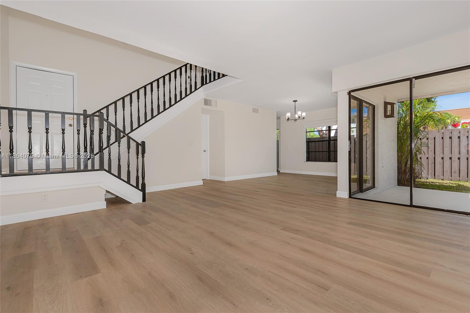 Welcome to a simply gorgeous and completely renovated two story townhouse located in cool-de-sac. The impressive living room and dining area, share volume ceilings, which exude a home like feeling. Brand new laminate floors, kitchen cabinets with stone countertops and stainless steel appliances. Delightful eat in kitchen with views to the patio. Impeccably renovated bathrooms. Full laundry room, half bath and storage area also on first floor. Second floor has two bedrooms. The main bedroom has a large walk in closet and oversized vanity area and a lovey balcony. The second bedroom has an oversized wall to wall closet, wonderful lighting. Brand new light fixtures throughout. Blinds on the windows. Great wrap around yard, perfect for entertainment and for the kiddies! No pets allowed.