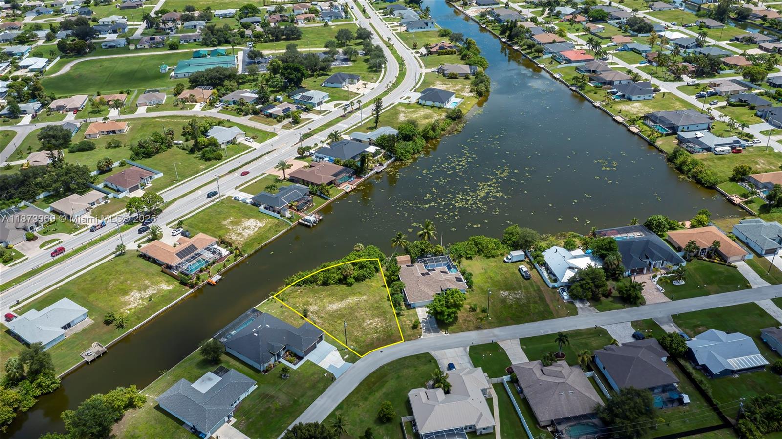 Build your dream home on this oversized pie-shaped waterfront lot offering more than a quarter acre with 135 feet of shoreline on a stunning freshwater intersecting canal basin. Enjoy wide southeast-facing views across the water. Located in a prime SE Cape Coral neighborhood close to restaurants, shopping, and area attractions, this property is ready for construction with city water and sewer already in place. The freshwater canal system provides endless opportunities for fishing, boating, kayaking, and bird watching, with species like largemouth bass, peacock bass, and bluegill right in your backyard. With no HOA and not located in a flood zone, this property combines peace of mind with an ideal waterfront lifestyle in one of Cape Coral’s most desirable settings.