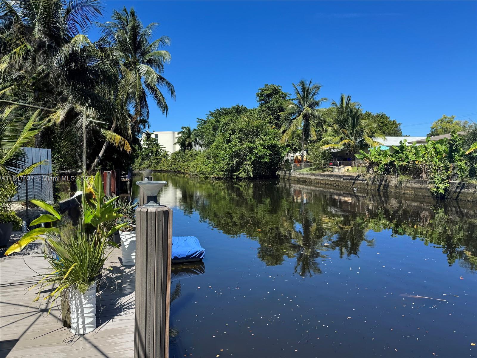 Beautiful almost 9000 sq.ft. Ocean Access 60'+ waterfront lot with new 30' x 10' dock. Enjoy boating, kayaking, canoeing, or jetskiing directly from your personal backyard. Watch plenty of fish and crabs from your dock and get surprised by the occasional passing of a manatee. The 1608 sq.ft. house with attached carport is gutted and ready to be rebuild. Plenty of space to convert to a 3bed/3bath. Design it to fulfil your personal needs & wishes. Large yard has plenty of space for a pool. The least expensive Ocean Access home that I have found in South East Florida. Located close to Wilton Manors, the Beaches and Las Olas Blvd.