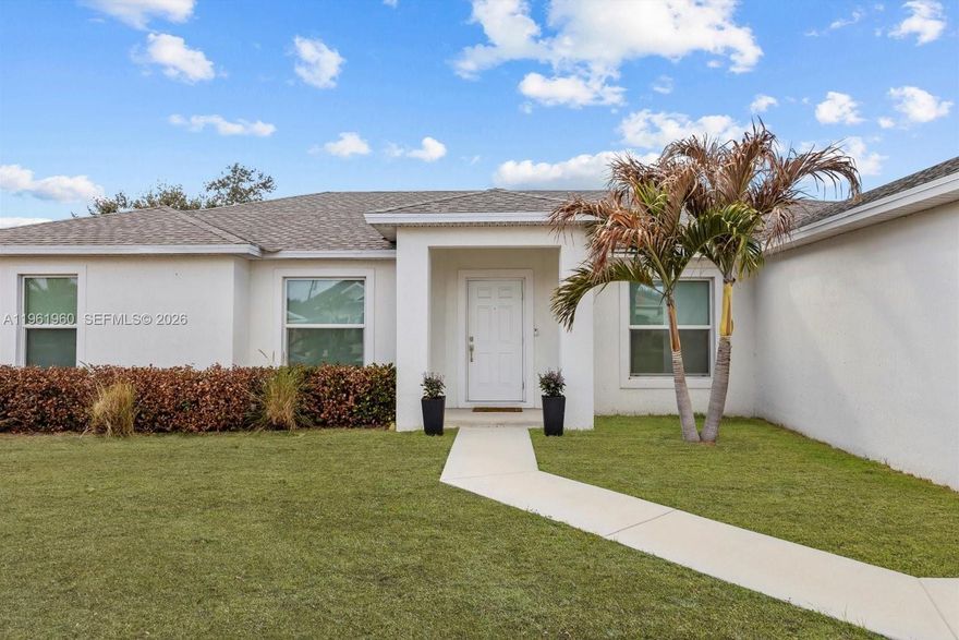 Welcome to this move-in-ready 2022-built home located in the heart of Port St. Lucie. Offering 3 bedrooms, 2 bathrooms, and 1,862 sq ft of modern living space, this home features a bright, open floor plan designed for entertaining and quality family time, enhanced by abundant natural light throughout. The split floor plan provides the primary bedroom with complete privacy, ideal for relaxation and comfort. The home offers no carpet, modern finishes, and a clean, contemporary design. The kitchen is equipped with high-end stainless steel appliances, and a front-load washer and dryer are included, making this property truly turnkey with no upgrades needed.
Situated on a GENEROUSLY SIZED lot, 10,350 sq ft, the property provides generous outdoor space with plenty of room for a pool, and added privacy enhanced by a newly installed fence. The owner has installed high-quality, elegant lighting in the dining, kitchen, and living areas, along with ambient lighting beneath the floating entertainment TV stand, which conveys with the sale. The home includes a 2-car garage plus driveway parking for up to 4 vehicles. Built in 2022, this home offers modern construction, efficiency, and style. Enjoy the freedom of NO HOA NO FLOOD INS & exceptional convenience with minutes access to the Turnpike & I95. Located near shopping centers, schools, parks, and community amenities, this home delivers space, privacy, and location in one exceptional package. Seller pays owners title policy and charges