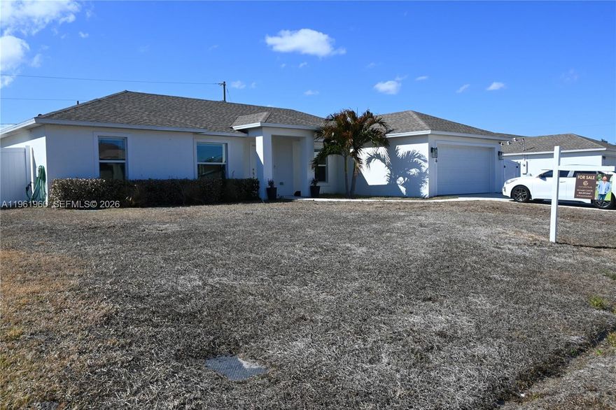 Welcome to this move-in-ready 2022-built home located in the heart of Port St. Lucie. Offering 3 bedrooms, 2 bathrooms, and 1,862 sq ft of modern living space, this home features a bright, open floor plan designed for entertaining and quality family time, enhanced by abundant natural light throughout. The split floor plan provides the primary bedroom with complete privacy, ideal for relaxation and comfort. The home offers no carpet, modern finishes, and a clean, contemporary design. The kitchen is equipped with high-end stainless steel appliances, and a front-load washer and dryer are included, making this property truly turnkey with no upgrades needed.
Situated on a rare double lot totaling approximately 10,350 sq ft, the property provides generous outdoor space with plenty of room for a pool, and added privacy enhanced by a newly installed fence. The owner has installed high-quality, elegant lighting in the dining, kitchen, and living areas, along with ambient lighting beneath the floating entertainment TV stand, which conveys with the sale. The home includes a 2-car garage plus driveway parking for up to 4 additional vehicles. Built in 2022, this home offers modern construction, efficiency, and style.
Enjoy the freedom of NO HOA NO FLOOD INS & exceptional convenience with approximately 1 minute access to the Florida Turnpike. Located near shopping centers, schools, parks, and community amenities, this home delivers space, privacy, and location in one exceptional package.