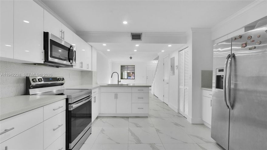 Move-in ready townhouse near FIU, completely remodeled and thoughtfully designed. This two-story home offers 2 bedrooms, 1.5 bathrooms, a private entrance, and a spacious patio ideal for relaxing or entertaining.The open-concept living area flows into a modern kitchen featuring quartz countertops and brand-new appliances, including an in-unit washer and dryer. A convenient half bathroom is located on the first floor, while both bedrooms and the full bathroom are upstairs, providing privacy and comfort. Tile flooring throughout with a marble look (No carpet).

Prime location close to schools, shopping centers, restaurants, and with easy access to major highways. Excellent value in a highly desirable area