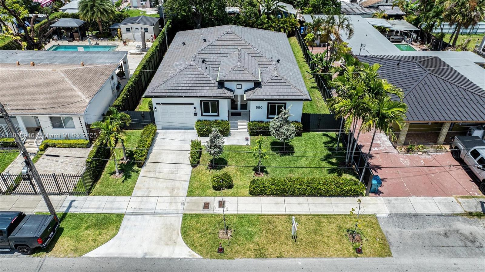 Discover this charming residence at 550 NW 58 Ct in Miami, FL. This new construction home boasts a spacious layout with ample natural light, featuring modern kitchen and bath areas. Well equipped, tile throughout, Sprinkler system and Alarm. The property includes a beautifully landscaped yard, appropriate for outdoor enjoyment. Conveniently centrally located near shopping, dining, and major transportation routes, this home offers a desirable blend of comfort and accessibility in a vibrant neighborhood. Don't miss the opportunity to explore this inviting property.