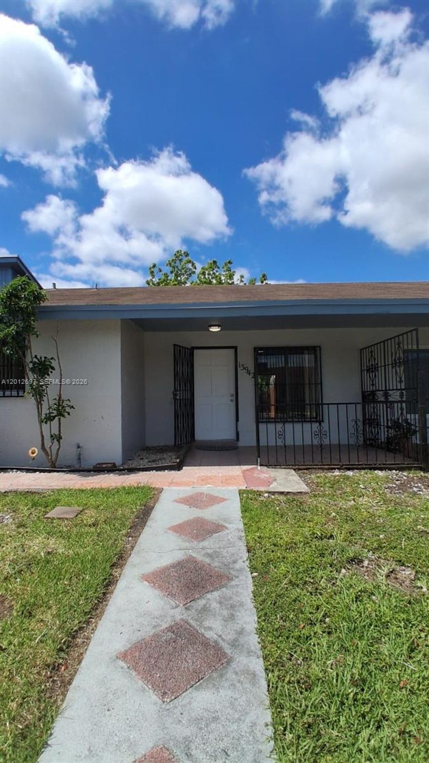 Beautiful and move-in ready 2-bedroom, 2-bath villa! This well-maintained home features updated bathrooms, a remodeled kitchen with brand-new stainless steel appliances, including washer and dryer, as well as new flooring and fresh paint throughout. Enjoy high-volume ceilings, ceiling fans, open layout that enhances the sense of space.  The property offers spacious bedrooms, including a primary suite with a walk-in closet. Additional highlights include a dedicated laundry/utility room and a private fenced patio, perfect for relaxing or entertaining.  Located in a community with nighttime security, this home provides both comfort and peace of mind. A must-see!