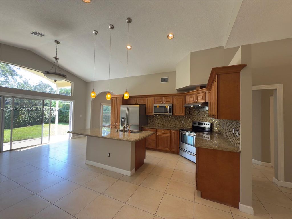 Photo of 5738 NW 48th Dr, Coral Springs, FL 33067 (MLS # A11782905)